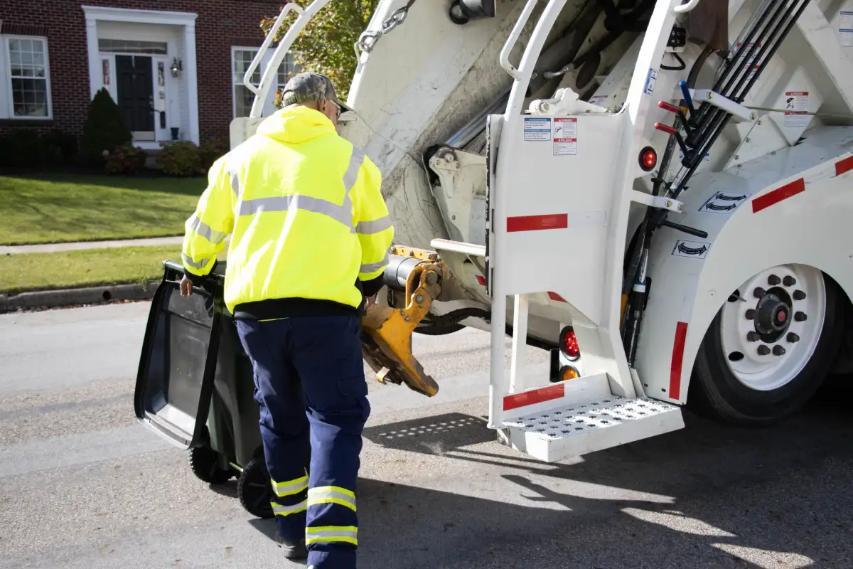 Rumpke Residential Trash Pickup Worker With Container Cleveland Ohio